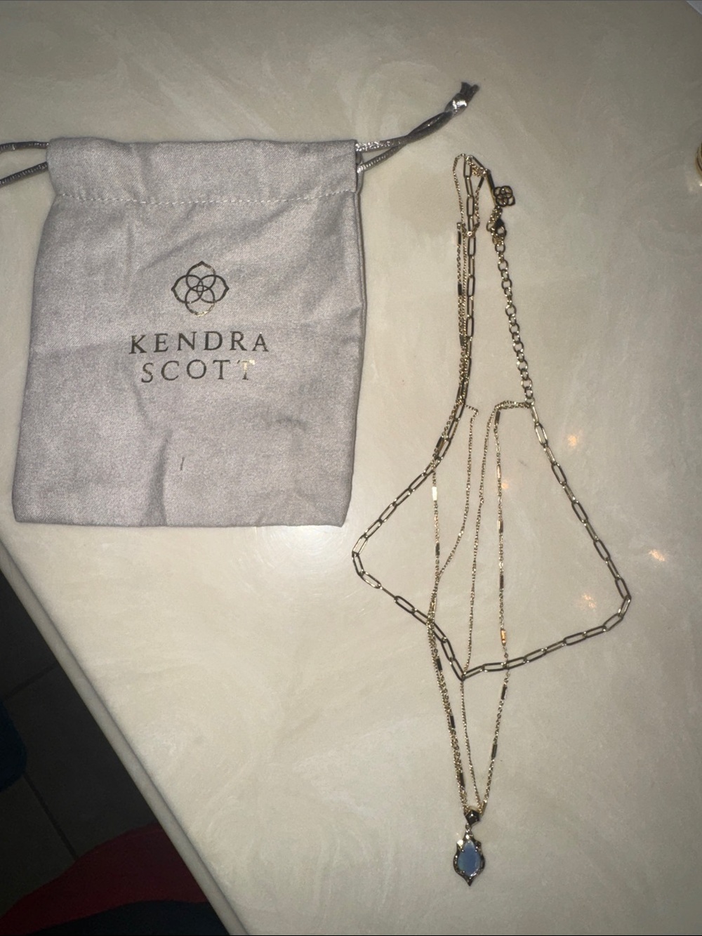 Kendra Scott Gold Layered Necklace with Light Blue Pendant